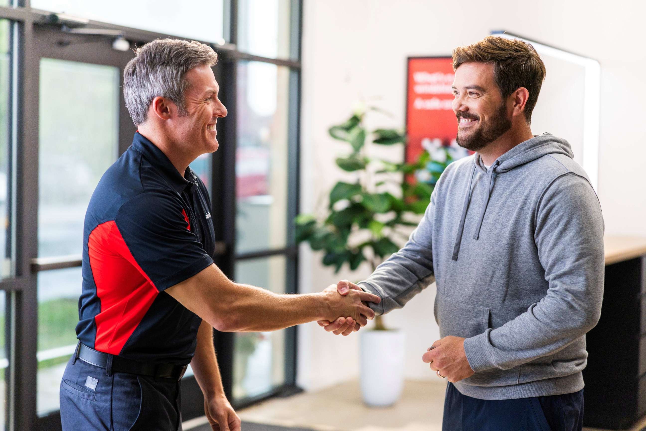 Techincian shaking hands with customer