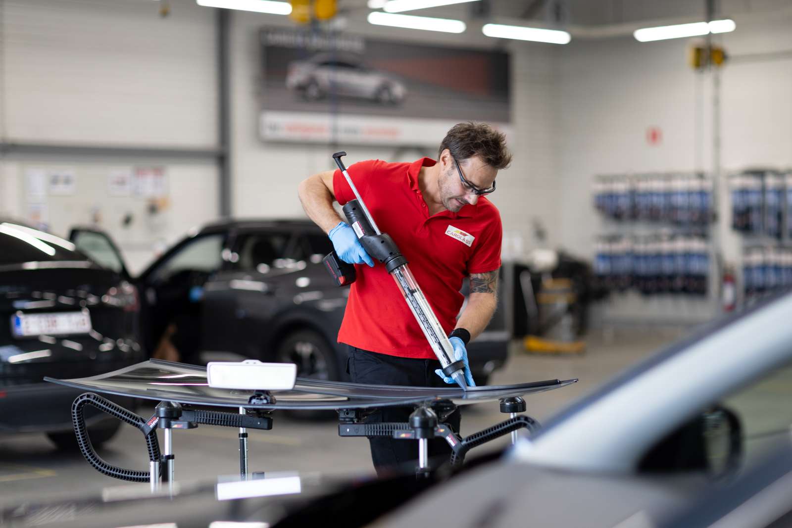 Technician applying adhesive