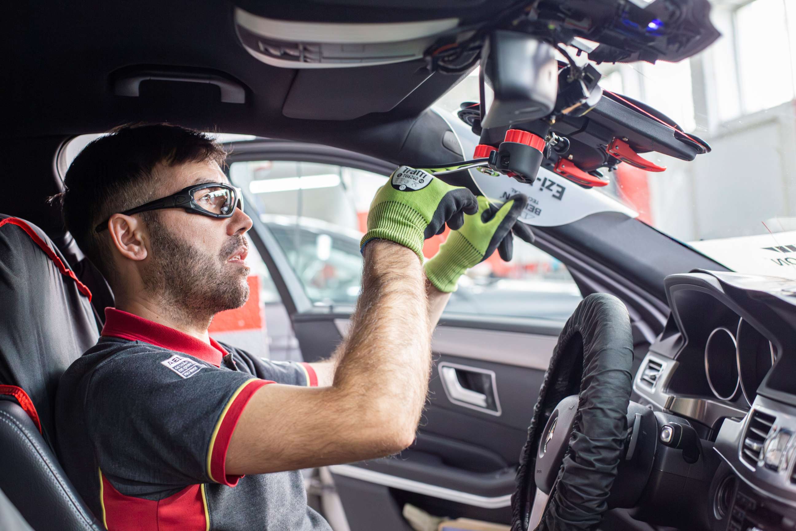 Technican removing a windscreen