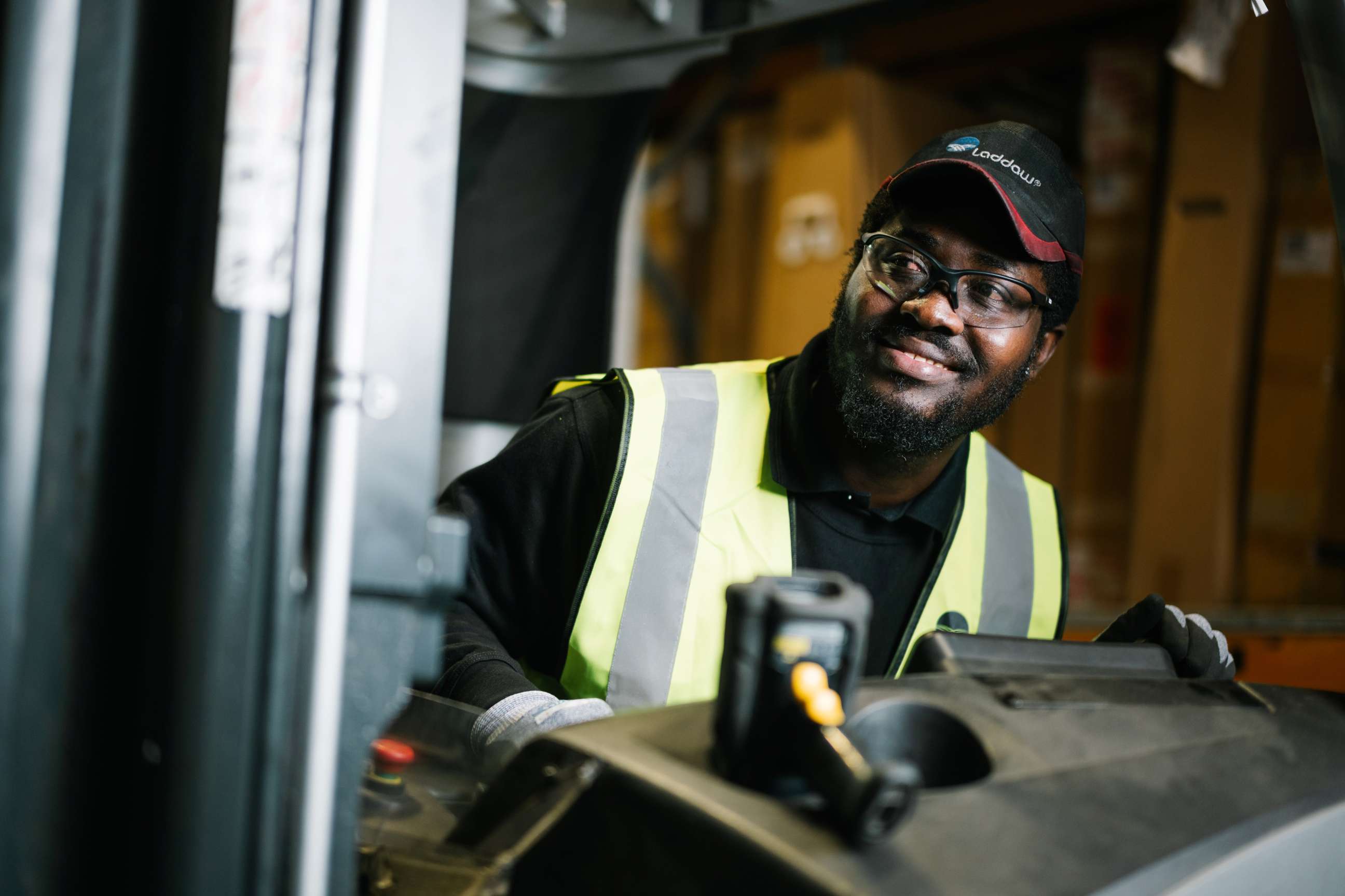 Warehouse colleague operating machinery