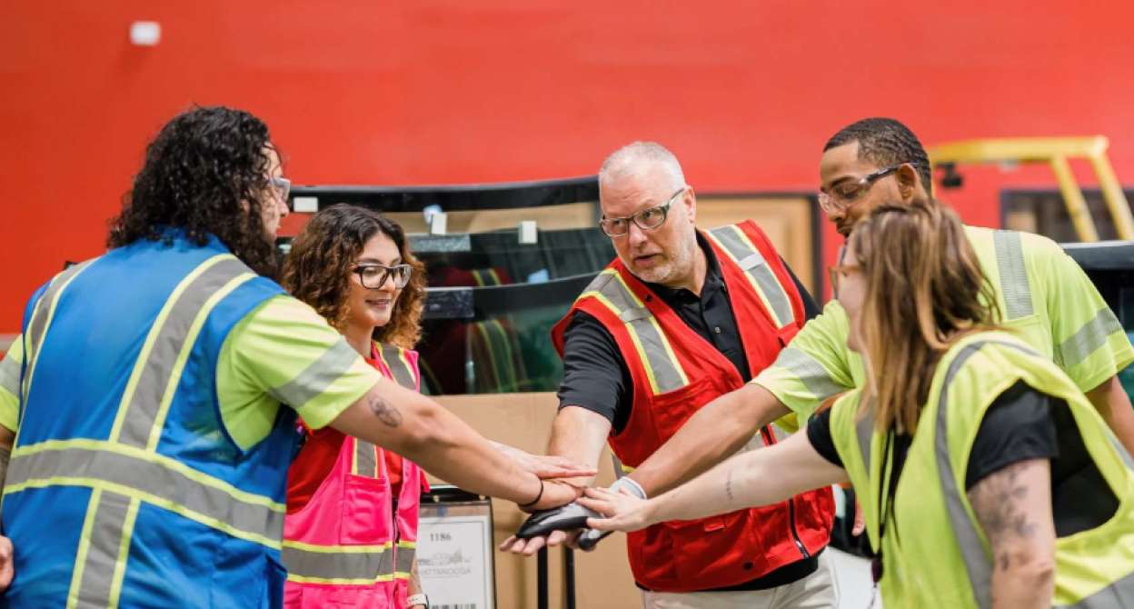 Warehouse colleagues team huddle
